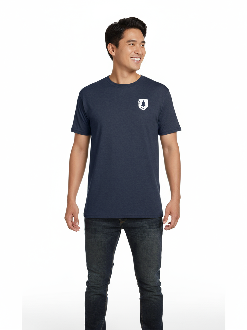 A person wearing a navy-colored crew neck T-shirt with a logo on the upper right chest area.