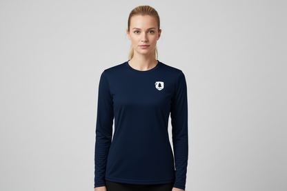 Woman wearing a navy long-sleeve shirt with a logo on a gray background
