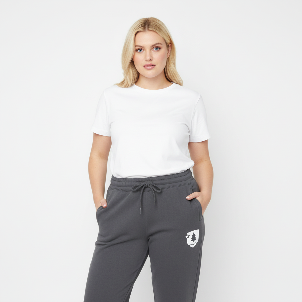 Woman wearing a white t-shirt and gray sweatpants with a logo on a white background
