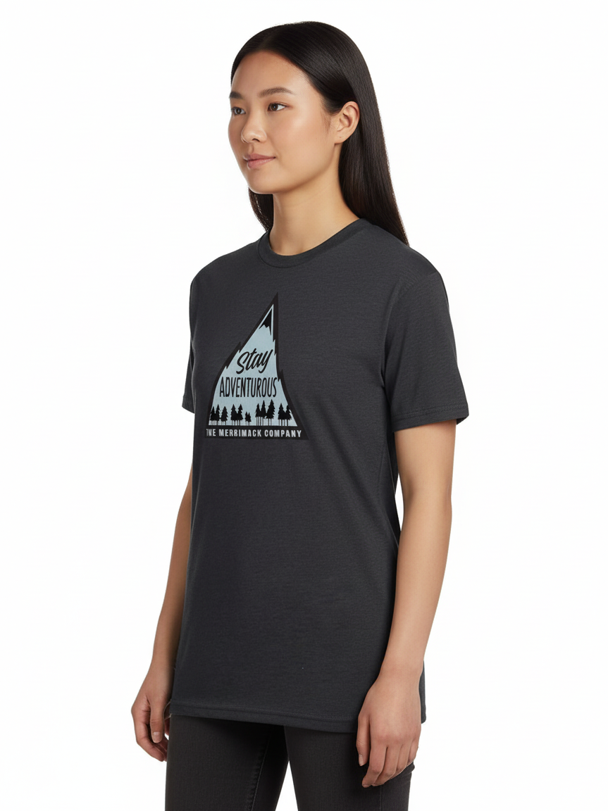 Woman wearing a black t-shirt with a graphic design on a light blue background