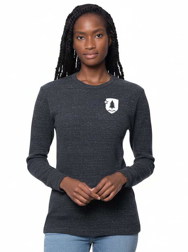 A person wearing a long-sleeved, gray thermal shirt with a small logo on the upper left chest area.