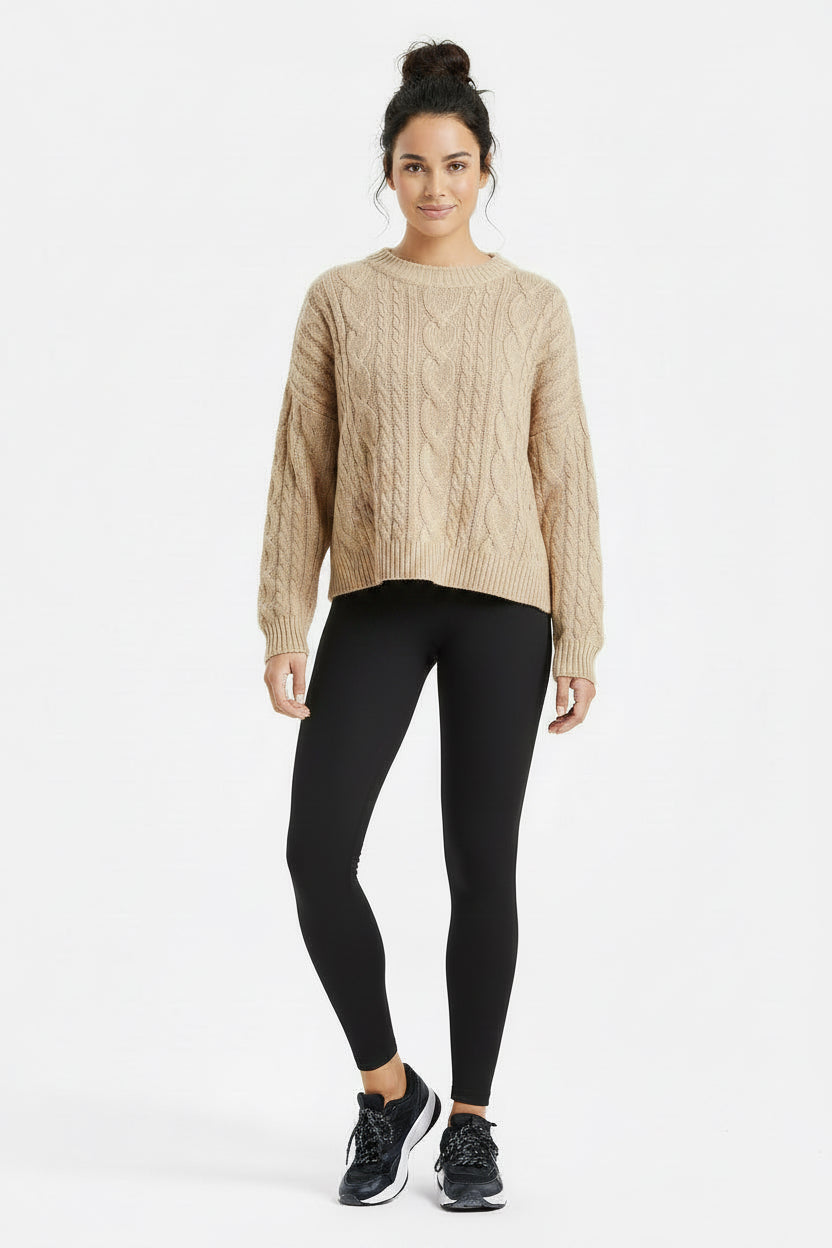 Black leggings worn by a person on a white background
