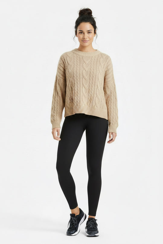 Black leggings worn by a person on a white background